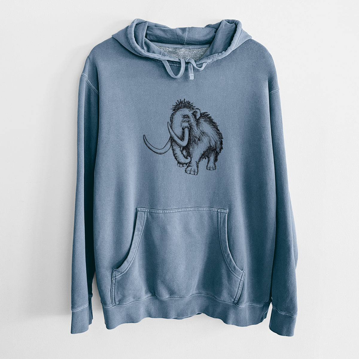 Slate blue pigment dyed hoodie laid flat, printed with a black ink illustration of a woolly mammoth with long curved tusks.