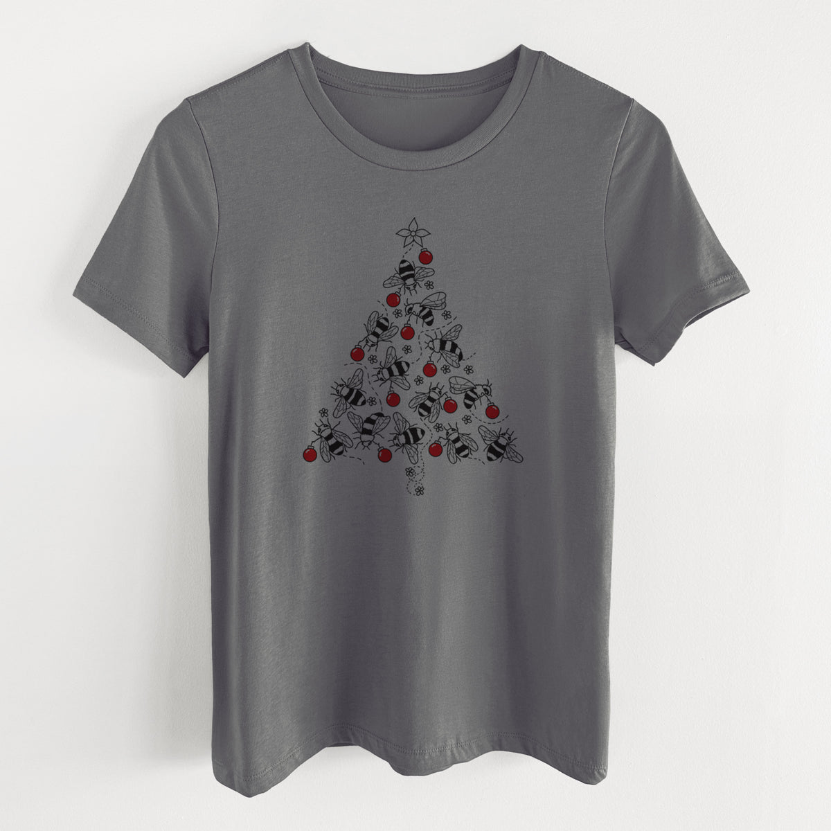 Asphalt women's relaxed fit cotton t-shirt laid flat, printed with a Christmas tree made of black ink bees with red ornaments and a star on top.