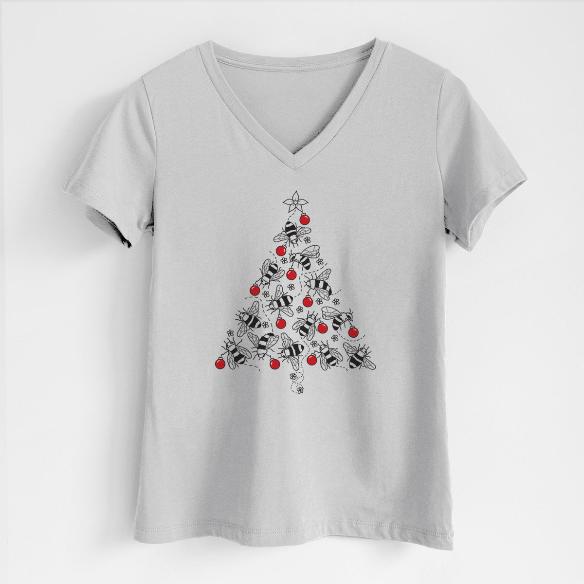 Lunar grey women's relaxed fit cotton V-neck t-shirt laid flat, printed with a Christmas tree made of black ink bees with red ornaments and a star on top.