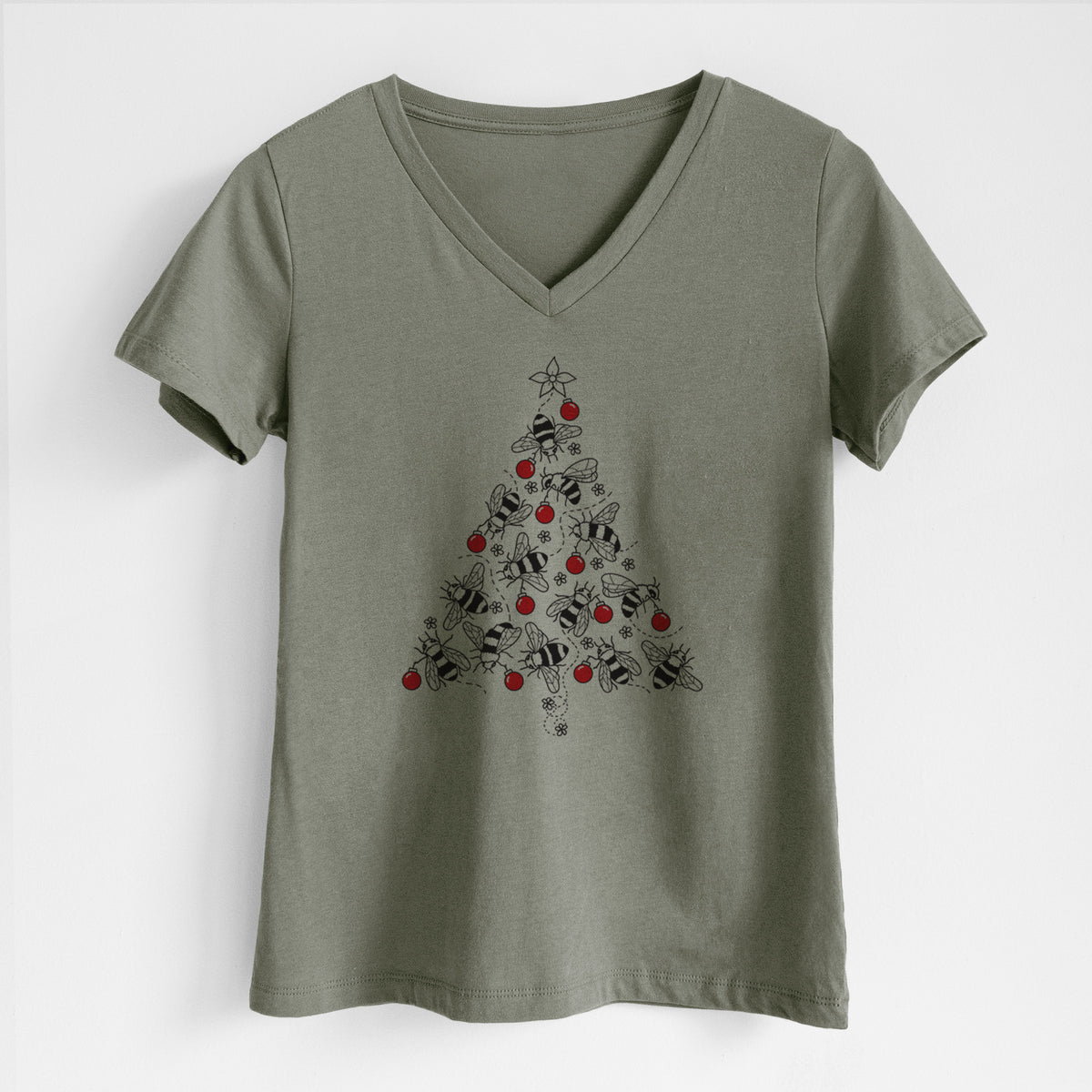 Military green women's relaxed fit cotton V-neck t-shirt laid flat, printed with a Christmas tree made of black ink bees with red ornaments and a star on top.