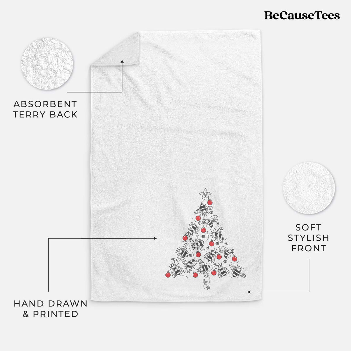 White hand towel printed with a Christmas tree made of black ink bees with red ornaments and a star on top.