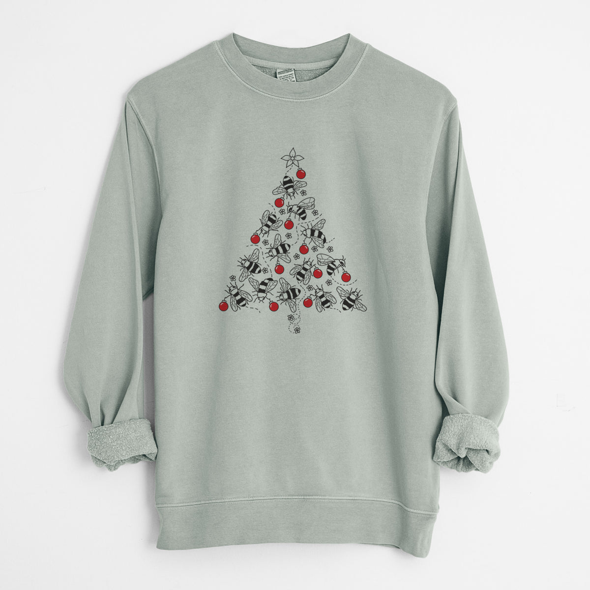 Sage green pigment dyed crewneck sweatshirt laid flat with the sleeves rolled, printed with a Christmas tree made of black ink bees with red ornaments and a star on top.