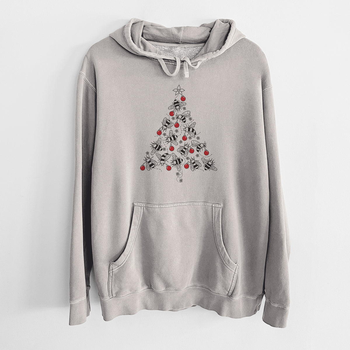 Cement grey pigment dyed hoodie laid flat, printed with a Christmas tree made of black ink bees with red ornaments and a star on top.