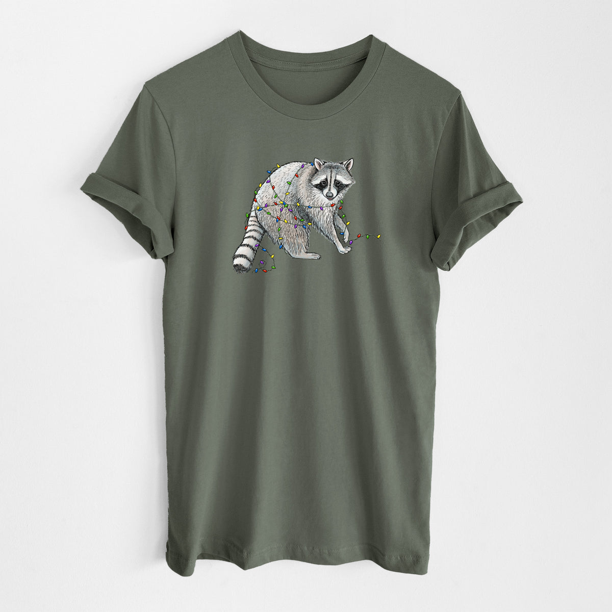 Military green lightweight cotton t-shirt laid flat, printed with a black ink raccoon tangled in a string of colorful holiday lights.