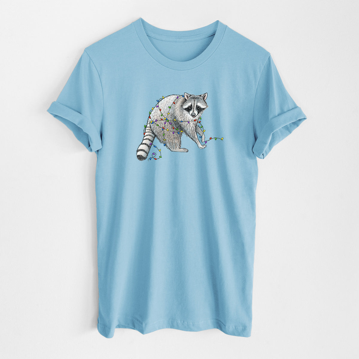 Ocean blue lightweight cotton t-shirt laid flat, printed with a black ink raccoon tangled in a string of colorful holiday lights.