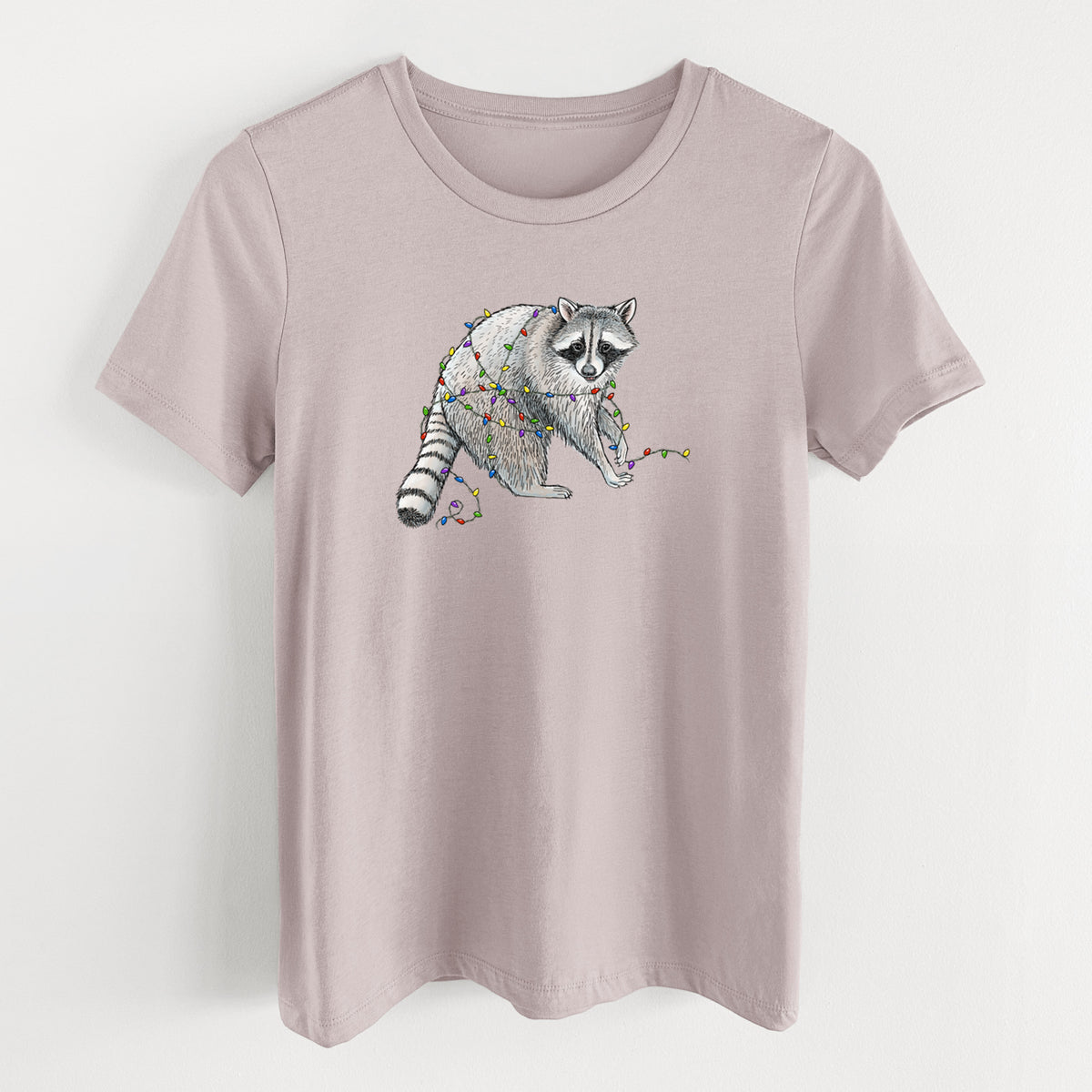 Pink gravel women's relaxed fit cotton t-shirt laid flat, printed with a black ink raccoon tangled in a string of colorful holiday lights.