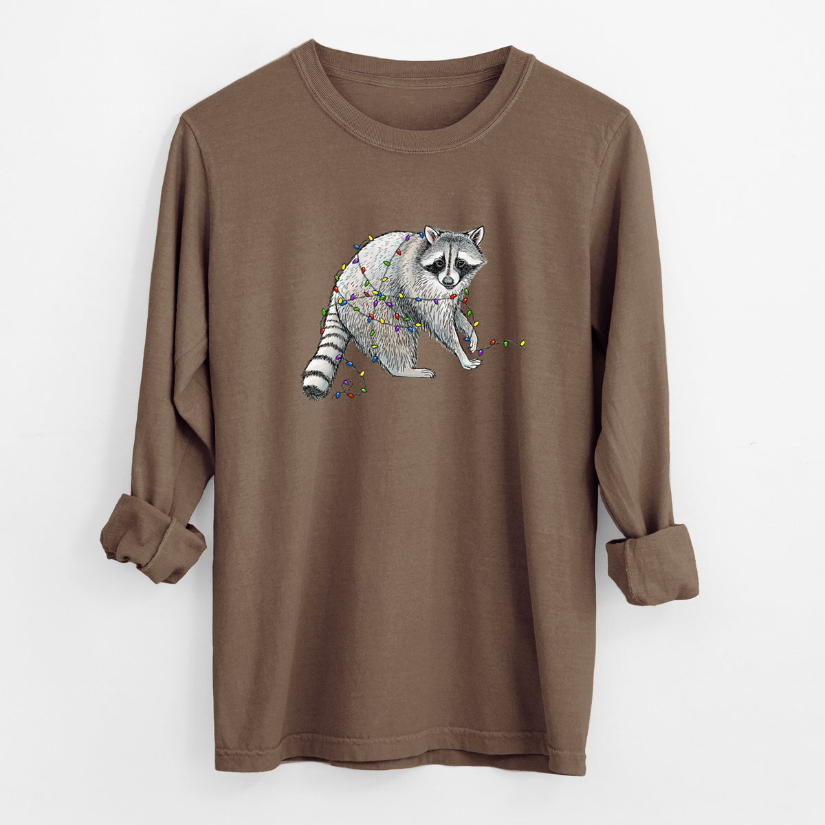 Espresso brown Comfort Colors long sleeve shirt laid flat with the cuffs rolled, printed with a black ink raccoon tangled in a string of colorful holiday lights.