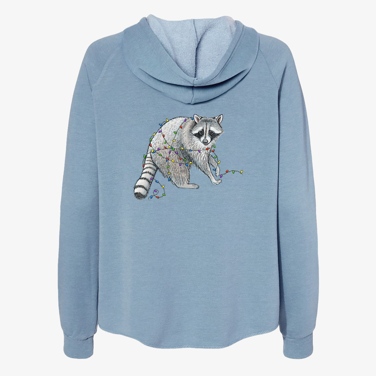 Misty blue women's Cali Wave zip-up sweatshirt laid flat, printed with a black ink raccoon tangled in a string of colorful holiday lights.