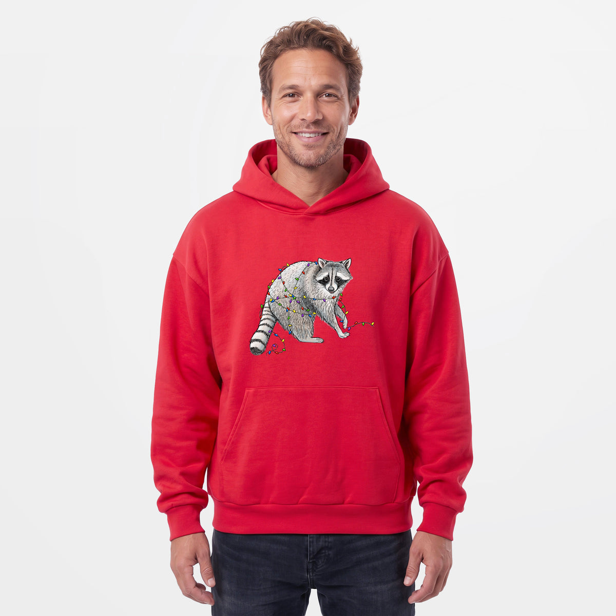 Male model wearing the Christmas Raccoon - Statement Midweight Hoodie.