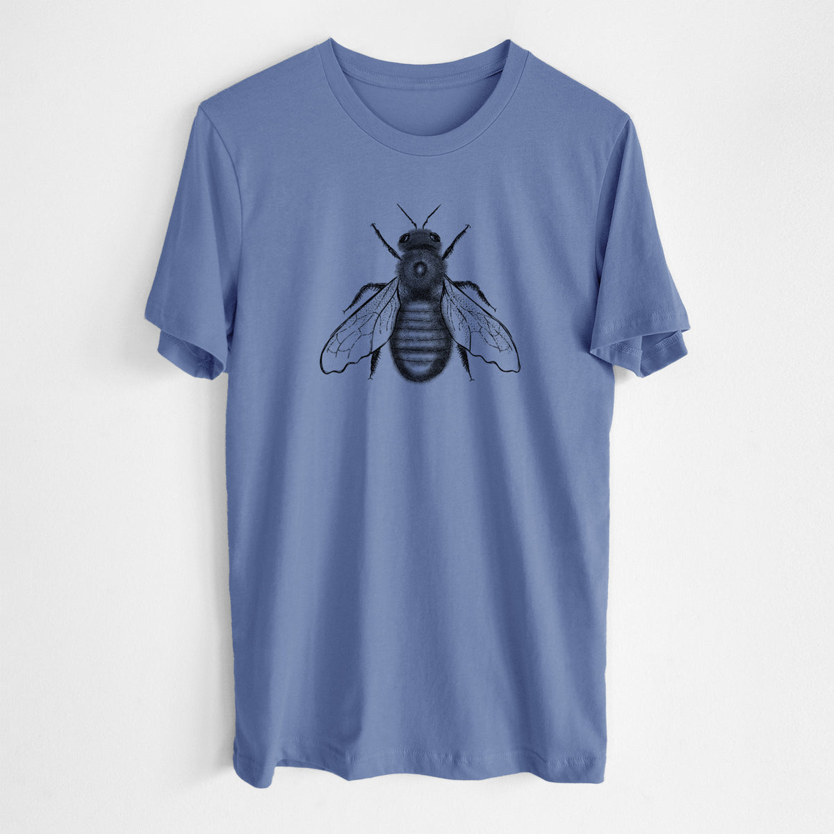 Blue bell lightweight cotton t-shirt laid flat, printed with a detailed black ink illustration of an eastern carpenter bee with its wings spread, seen from above.