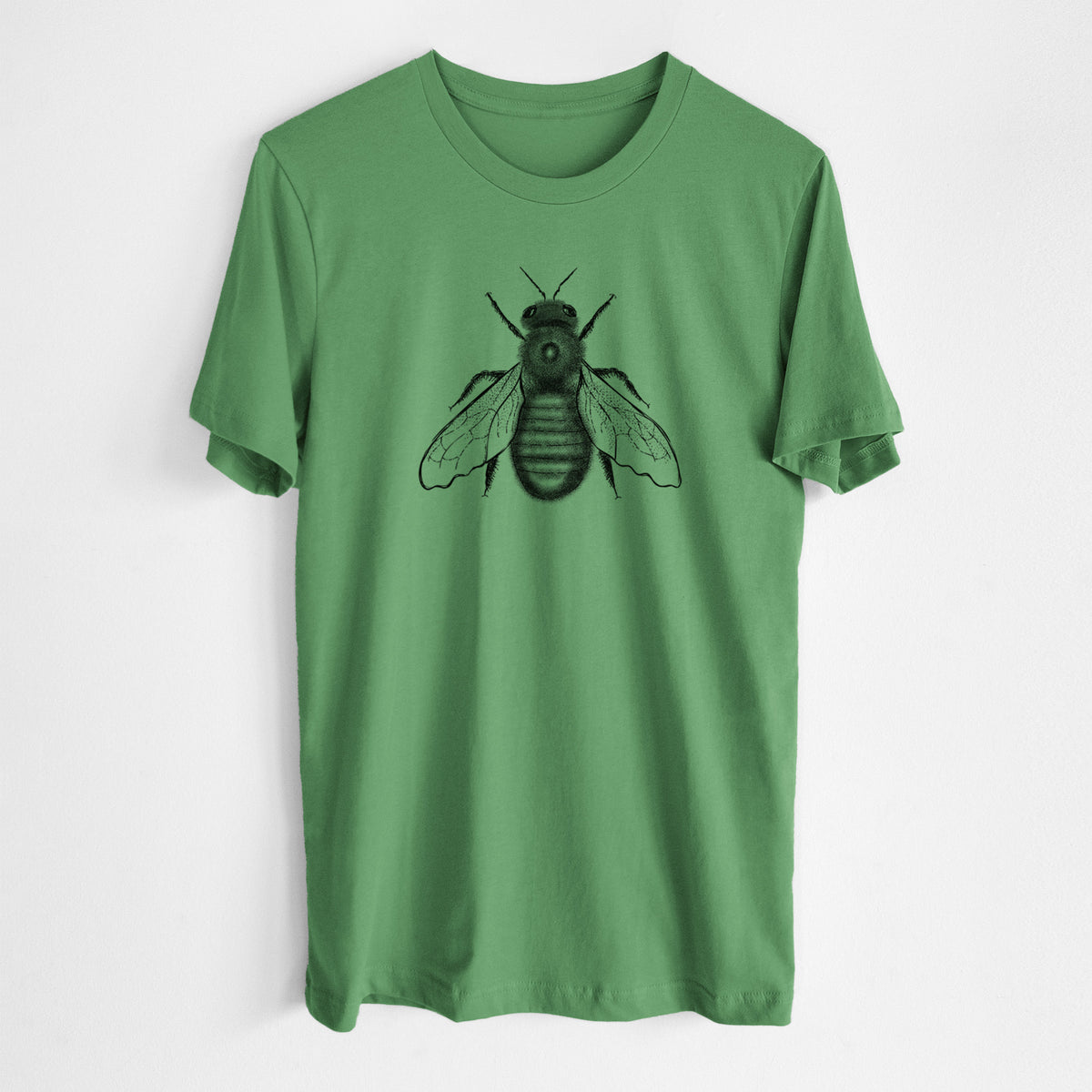 Leaf green lightweight cotton t-shirt laid flat, printed with a detailed black ink illustration of an eastern carpenter bee with its wings spread, seen from above.