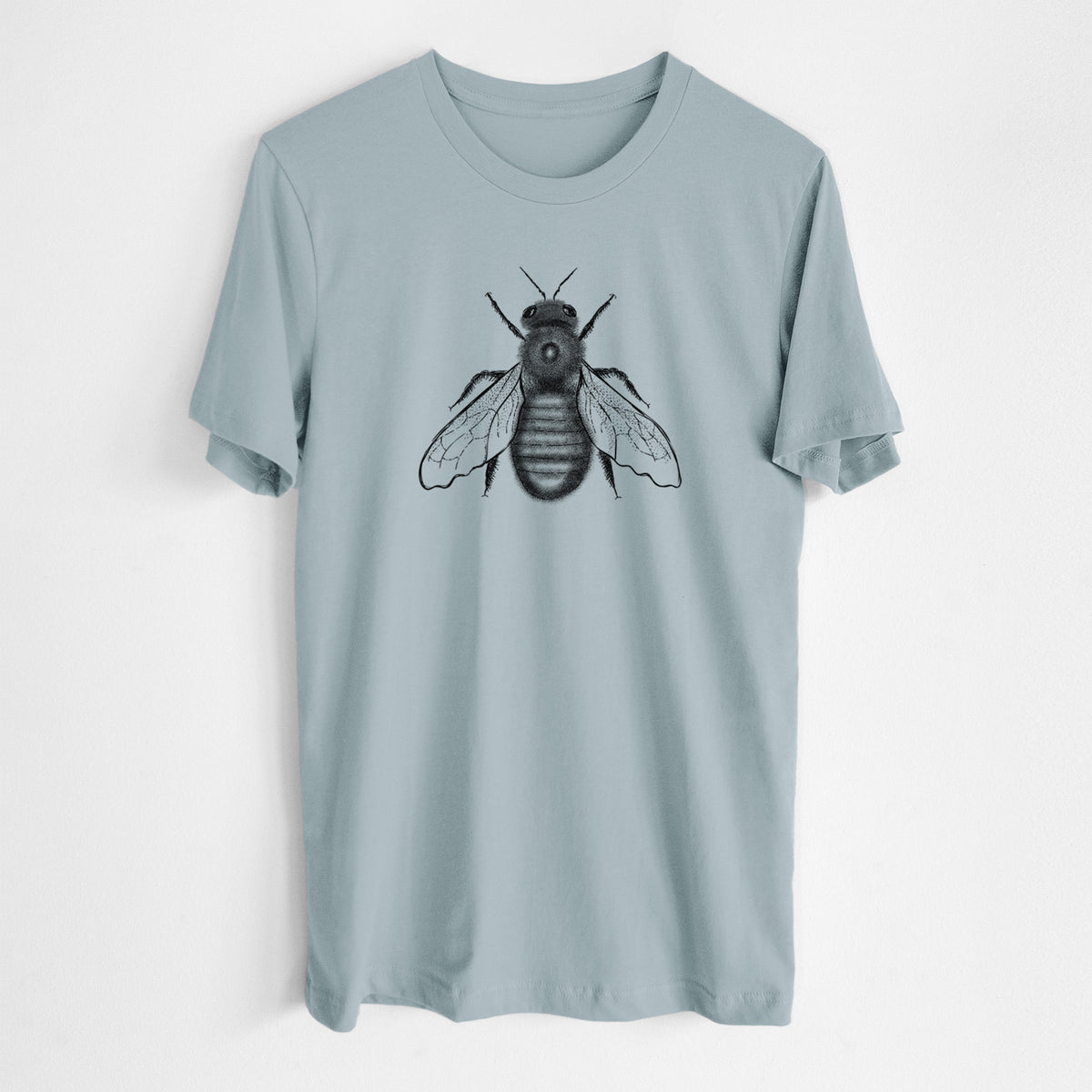 Vintage denim lightweight cotton t-shirt laid flat, printed with a detailed black ink illustration of an eastern carpenter bee with its wings spread, seen from above.