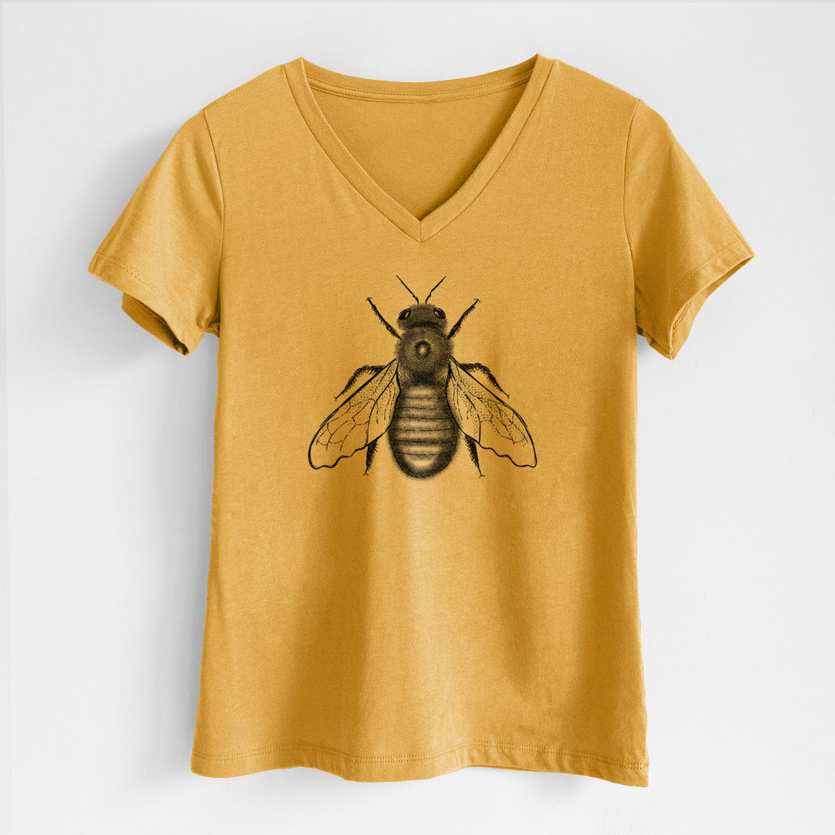 Honeycomb yellow women's relaxed fit cotton V-neck t-shirt laid flat, printed with a detailed black ink illustration of an eastern carpenter bee with its wings spread, seen from above.