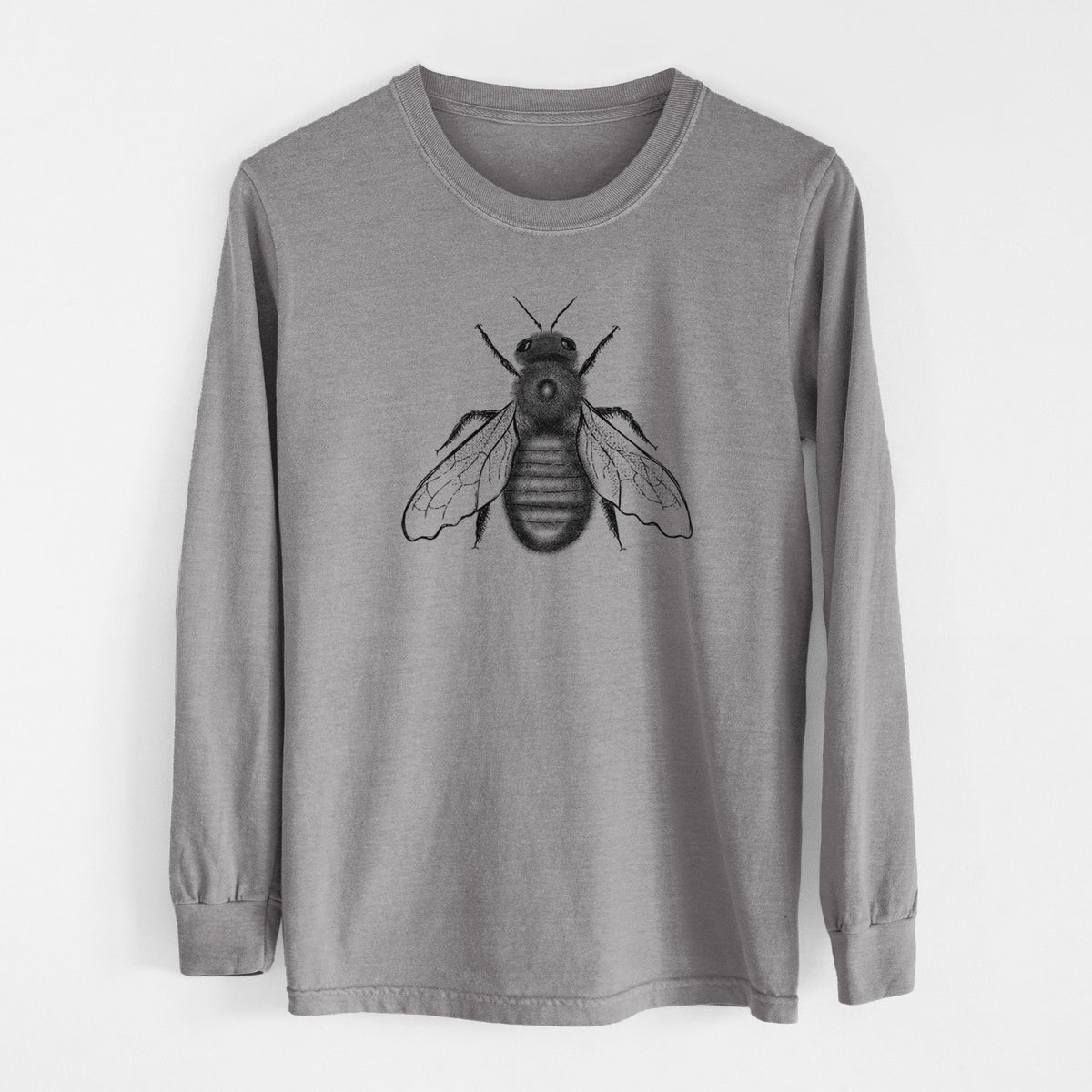 Grey Comfort Colors long sleeve shirt laid flat, printed with a detailed black ink illustration of an eastern carpenter bee with its wings spread, seen from above.