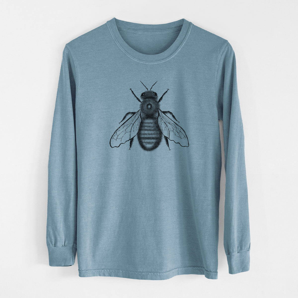 Steel blue Comfort Colors long sleeve shirt laid flat, printed with a detailed black ink illustration of an eastern carpenter bee with its wings spread, seen from above.