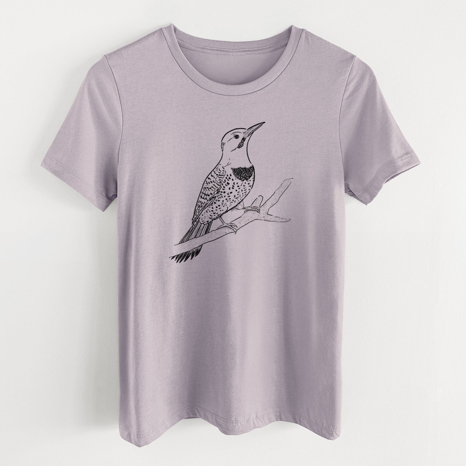 Light violet women's relaxed fit cotton t-shirt laid flat, printed with a detailed black ink illustration of a yellow-shafted northern flicker perched on a branch.