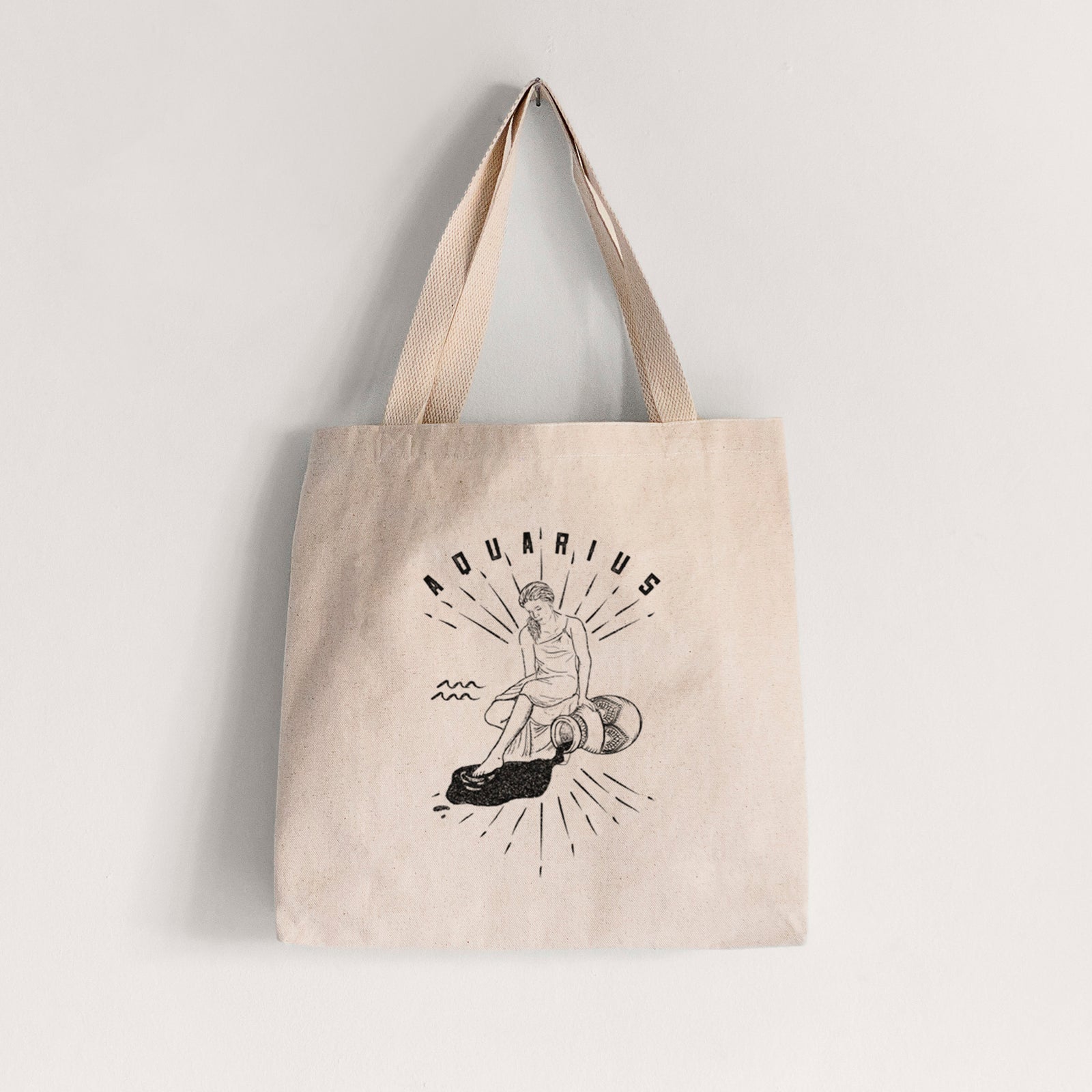 Natural canvas tote bag printed with a black ink figure pouring water with the word Aquarius, for the Aquarius zodiac sign.