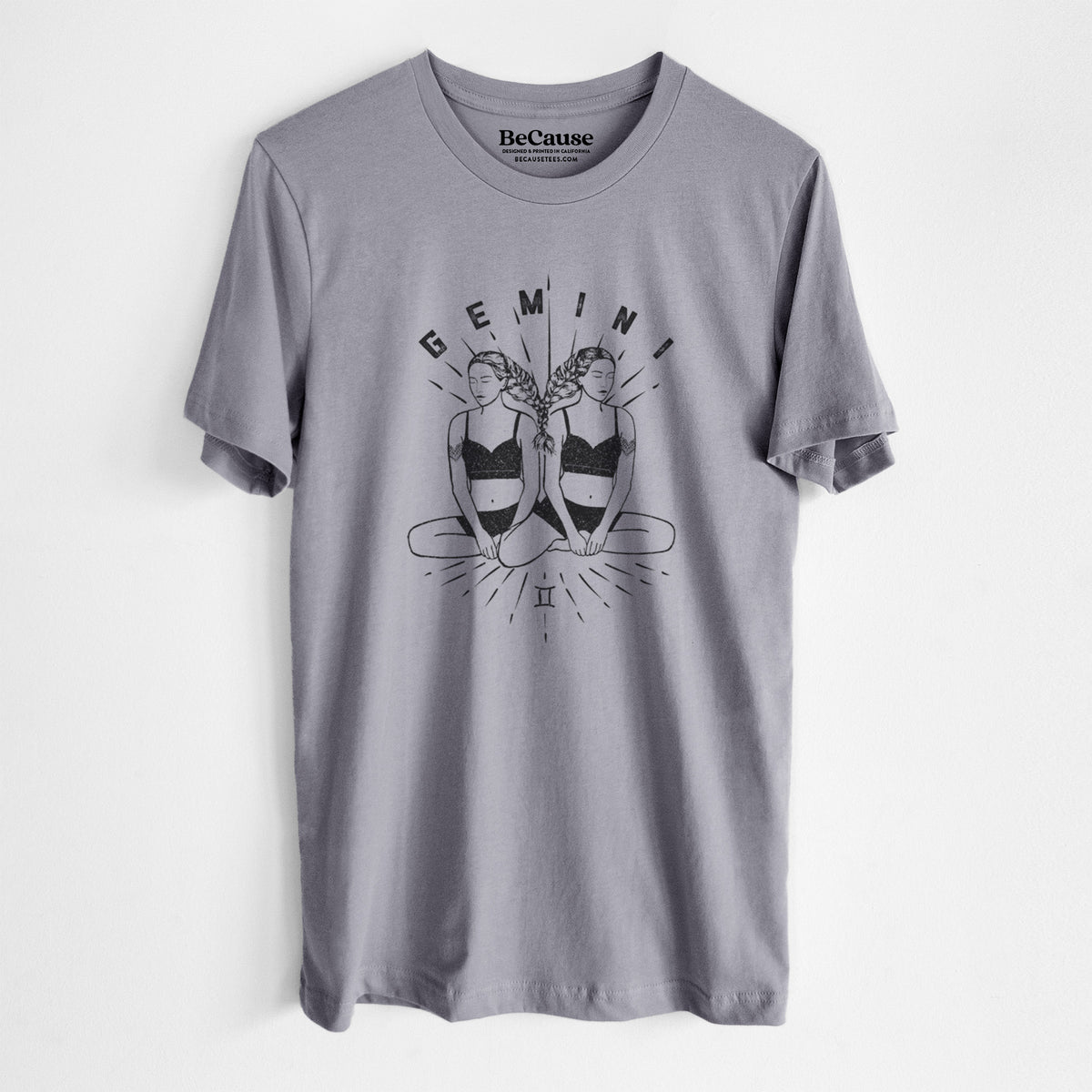 Storm grey lightweight cotton t-shirt laid flat, printed with black ink twin women sitting back to back with the word Gemini, for the Gemini zodiac sign.