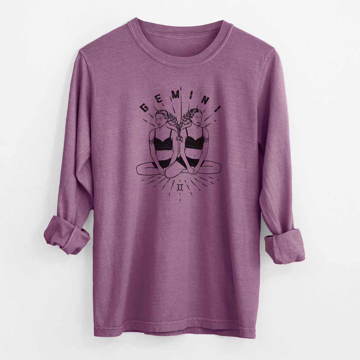 Berry pink Comfort Colors long sleeve shirt laid flat with the cuffs rolled, printed with black ink twin women sitting back to back with the word Gemini, for the Gemini zodiac sign.