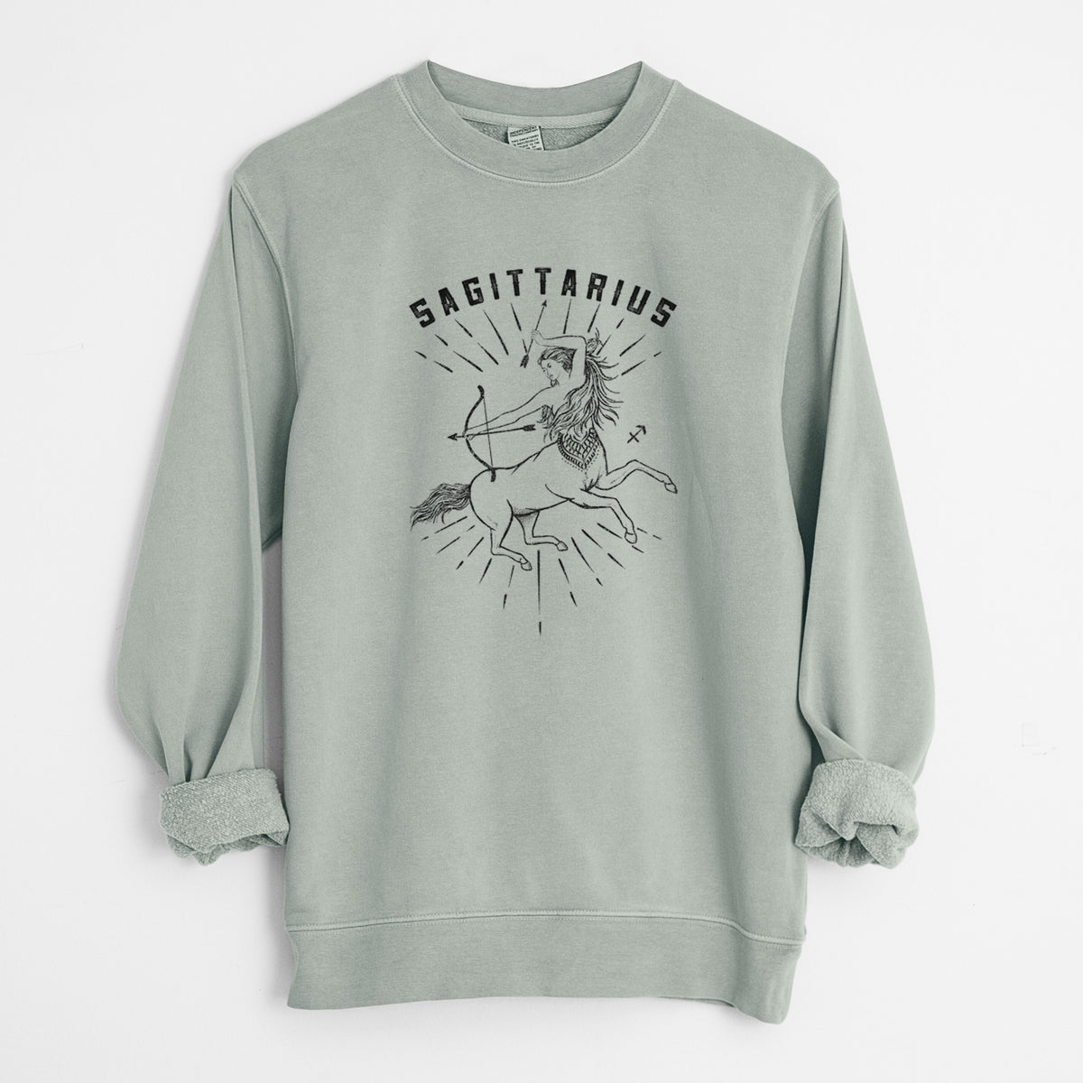 Sage green pigment dyed crewneck sweatshirt laid flat with the sleeves rolled, printed with a black ink centaur archer with the word Sagittarius, for the Sagittarius zodiac sign.