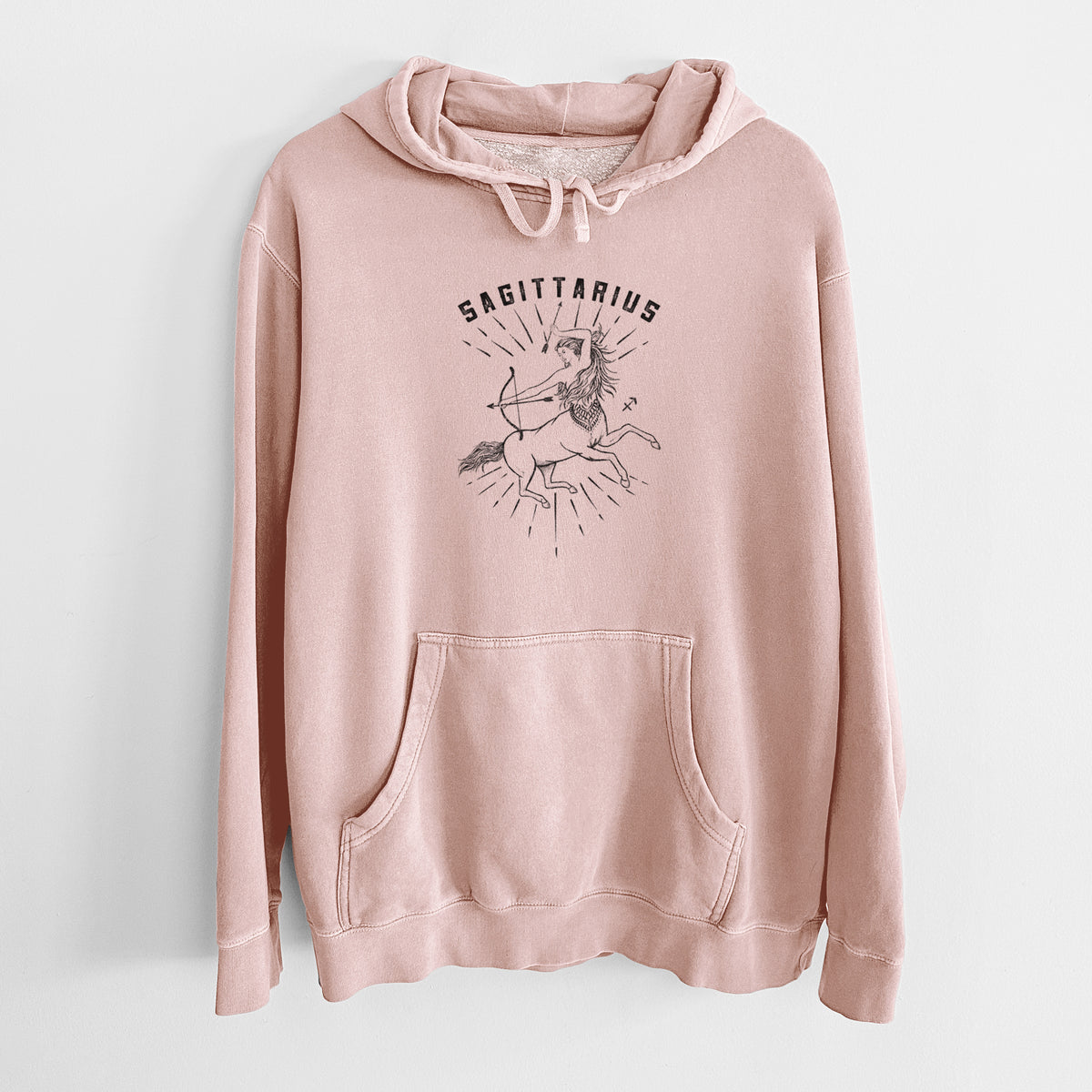 Dusty pink pigment dyed hoodie laid flat, printed with a black ink centaur archer with the word Sagittarius, for the Sagittarius zodiac sign.