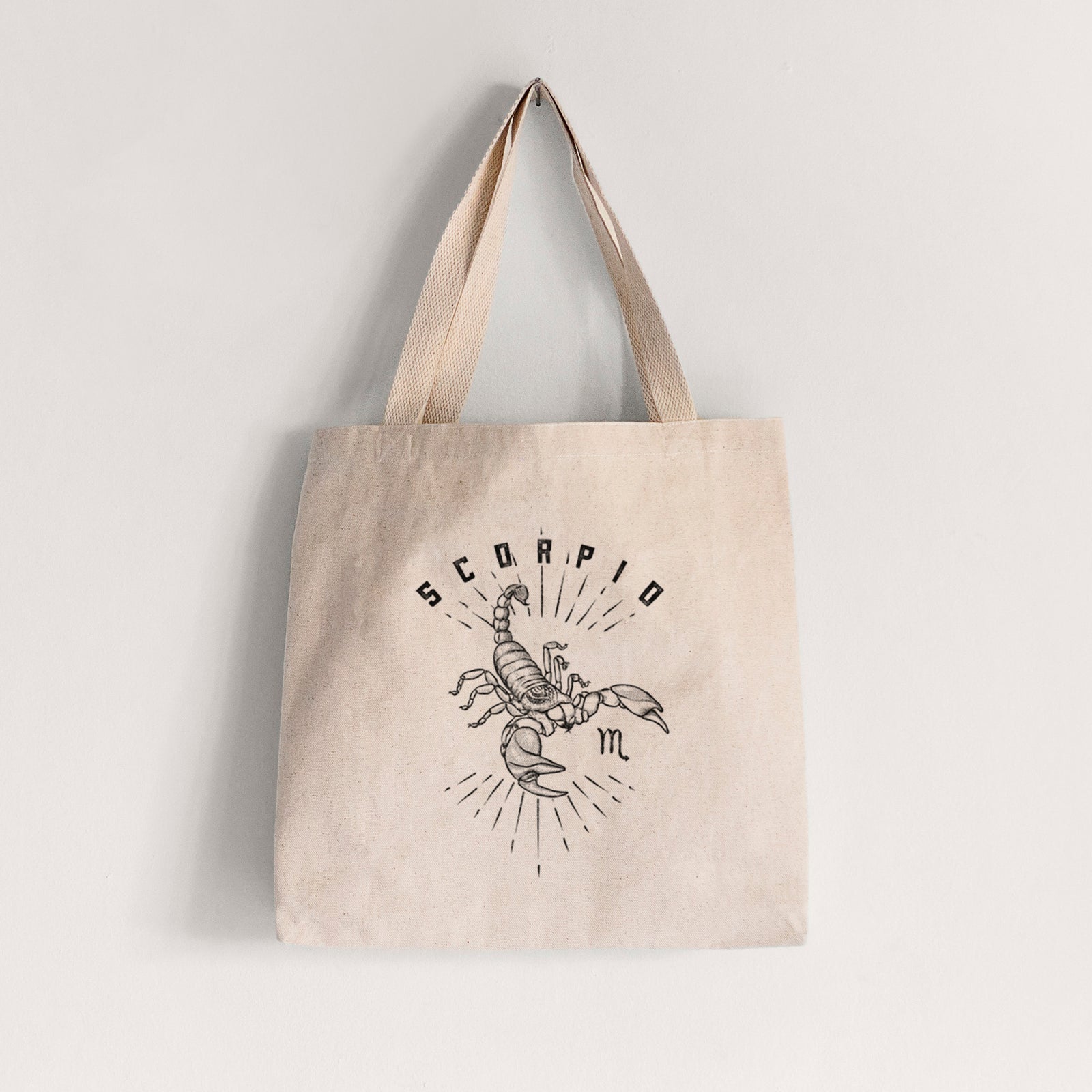 Natural canvas tote bag printed with a black ink scorpion with the word Scorpio, for the Scorpio zodiac sign.