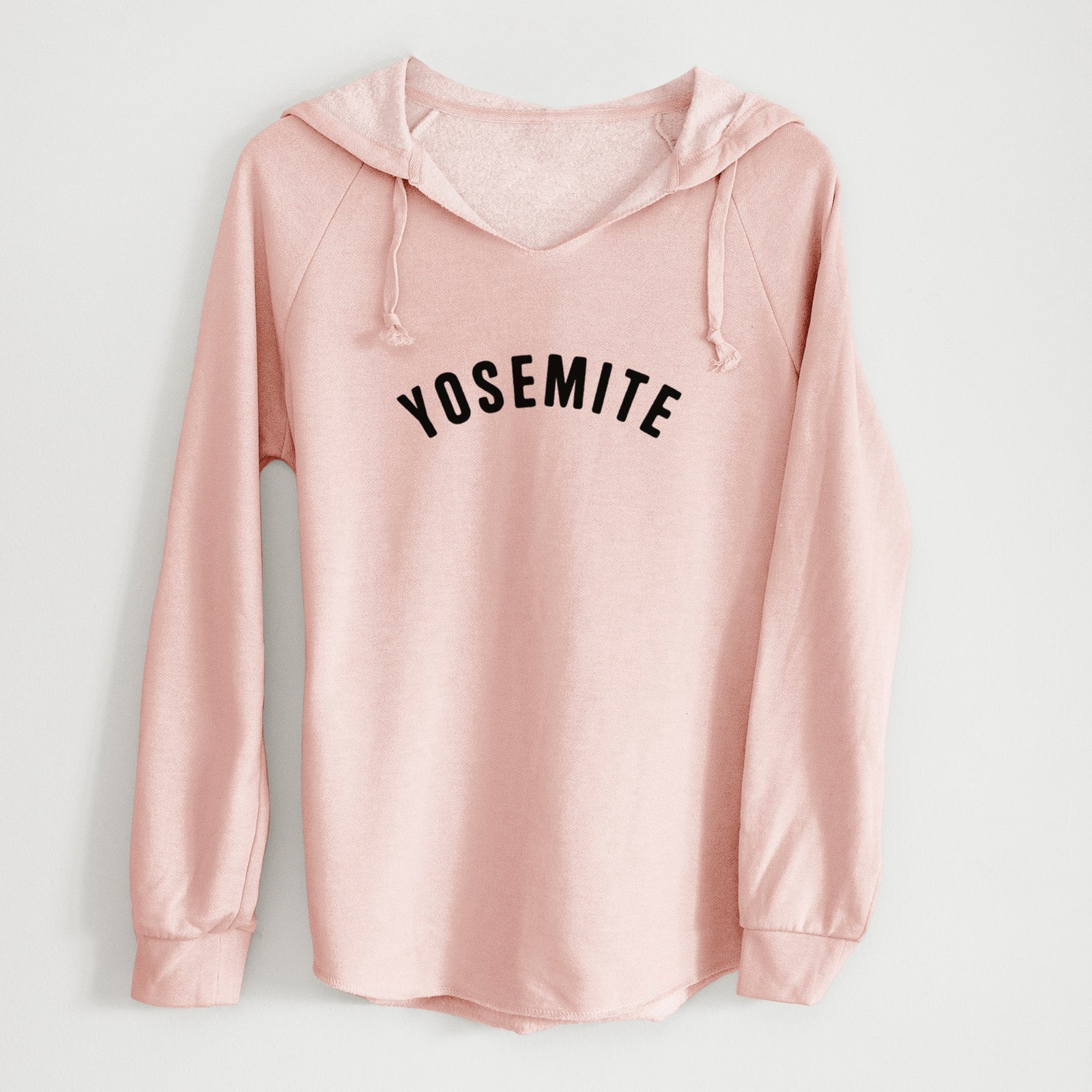 Sage green women's Cali Wave hooded sweatshirt laid flat, printed with the word Yosemite in bold black letters arched across the chest.