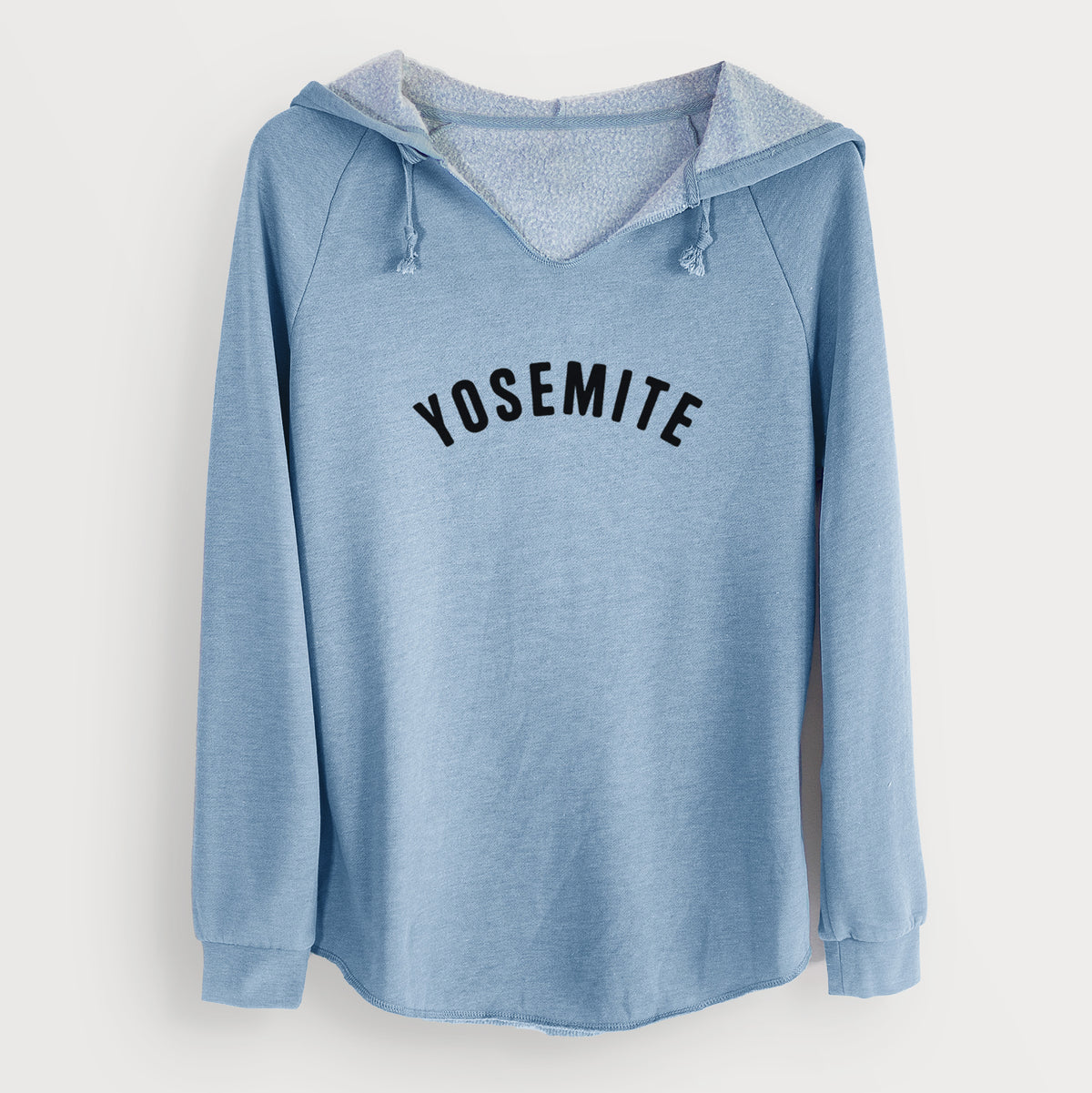 Misty blue women's Cali Wave hooded sweatshirt laid flat, printed with the word Yosemite in bold black letters arched across the chest.