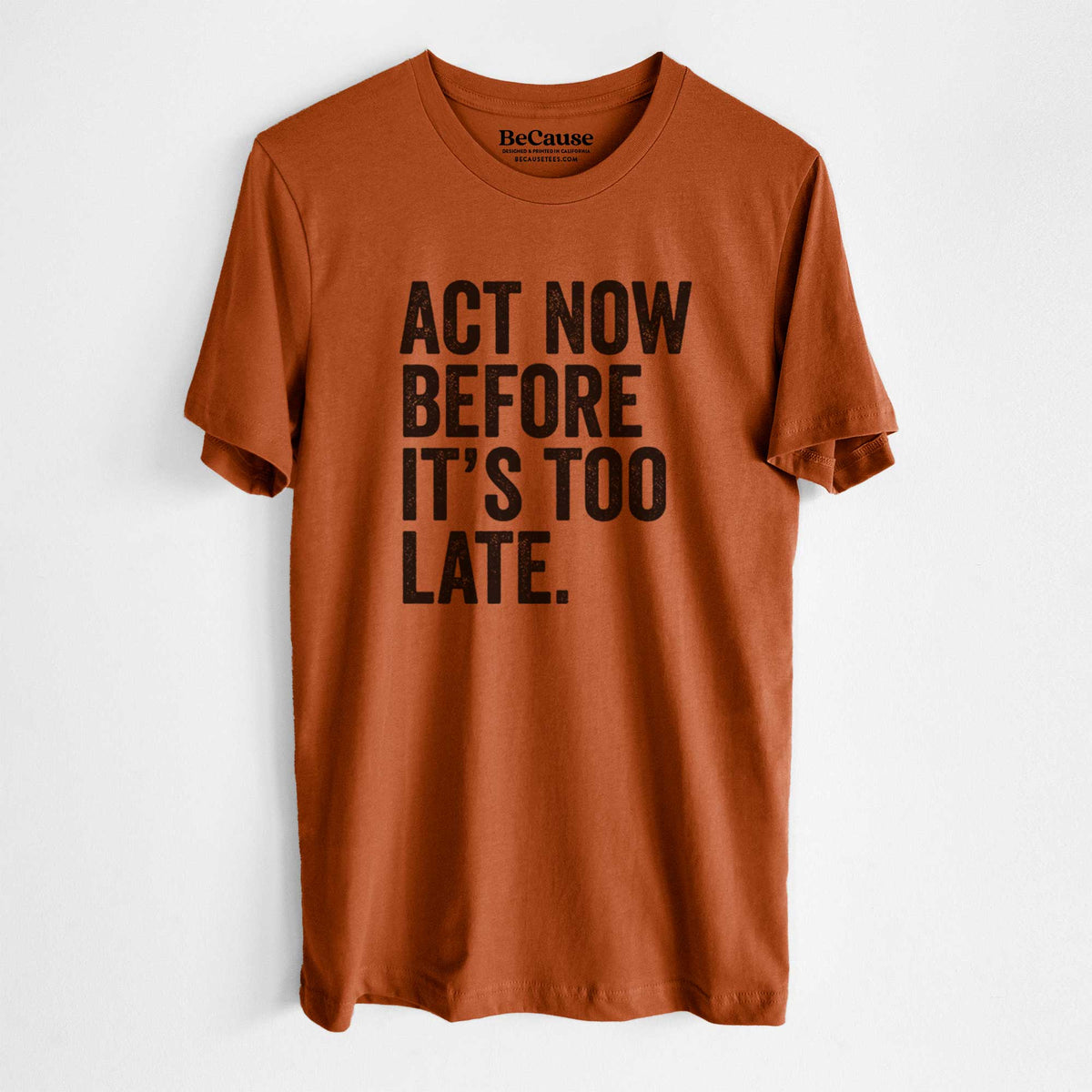 Autumn lightweight cotton t-shirt laid flat, printed with bold black words reading Act Now Before It's Too Late.