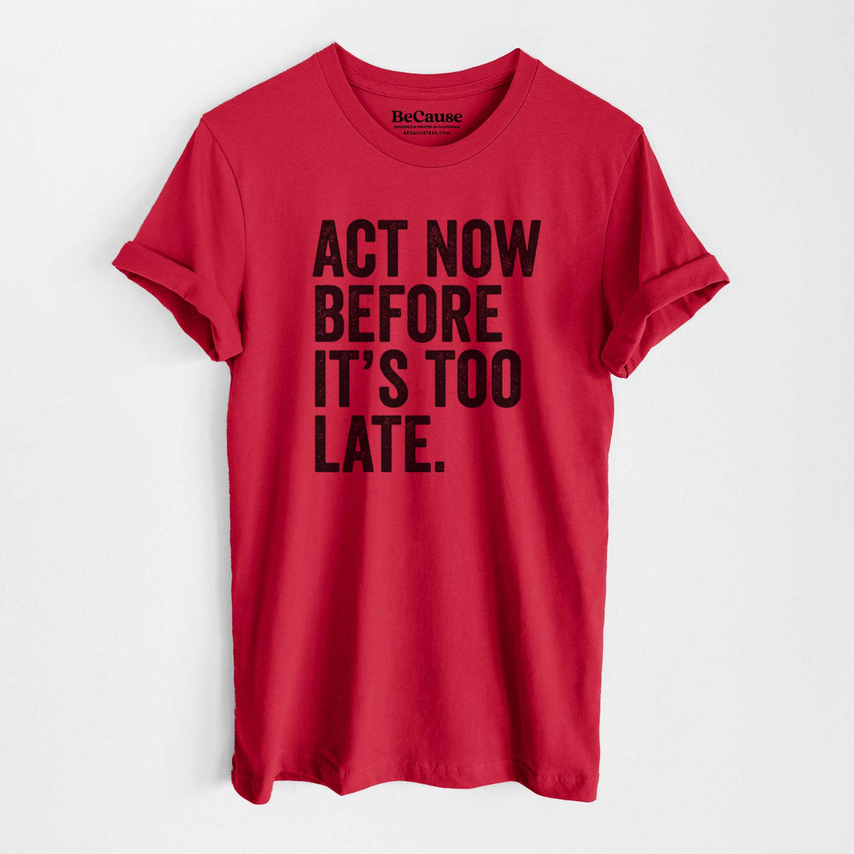Ruby red lightweight cotton t-shirt laid flat, printed with bold black words reading Act Now Before It's Too Late.