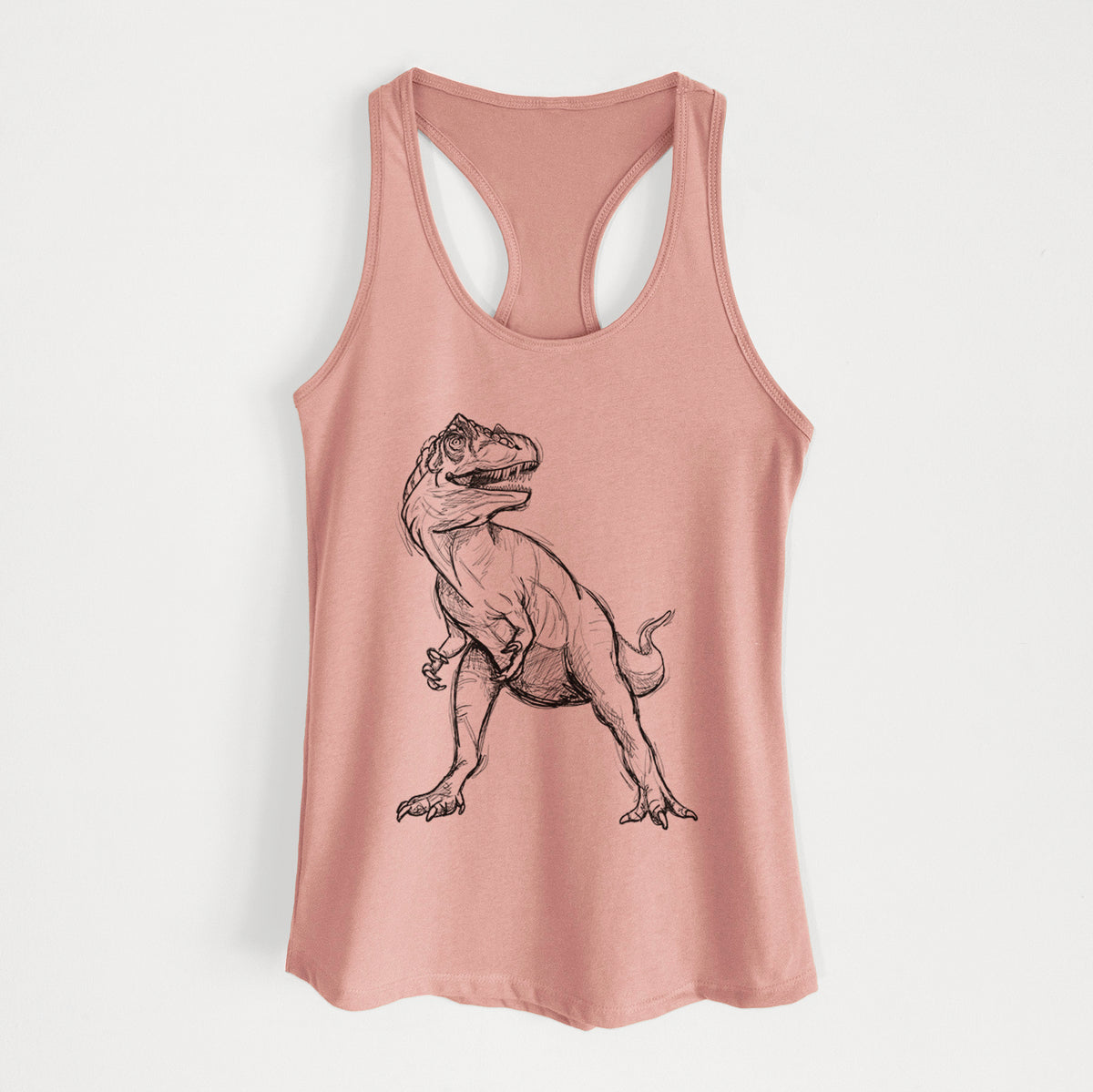 Desert pink women's racerback tank top laid flat, printed with a black ink illustration of an Allosaurus walking.