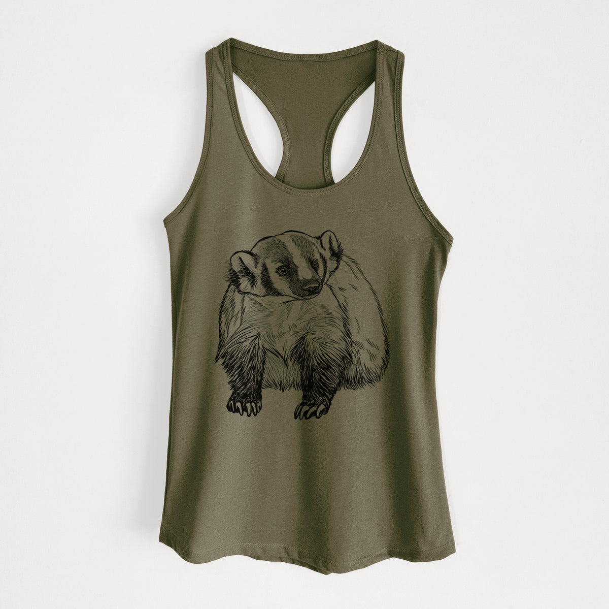 Military green women's racerback tank top laid flat, printed with a detailed black ink illustration of an American badger facing forward.