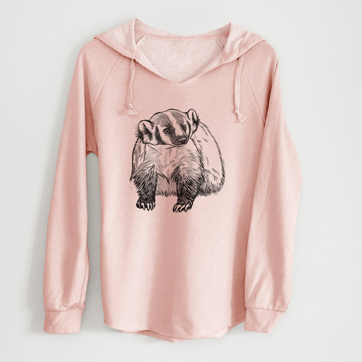 Blush pink women's Cali Wave hooded sweatshirt laid flat, printed with a detailed black ink illustration of an American badger facing forward.