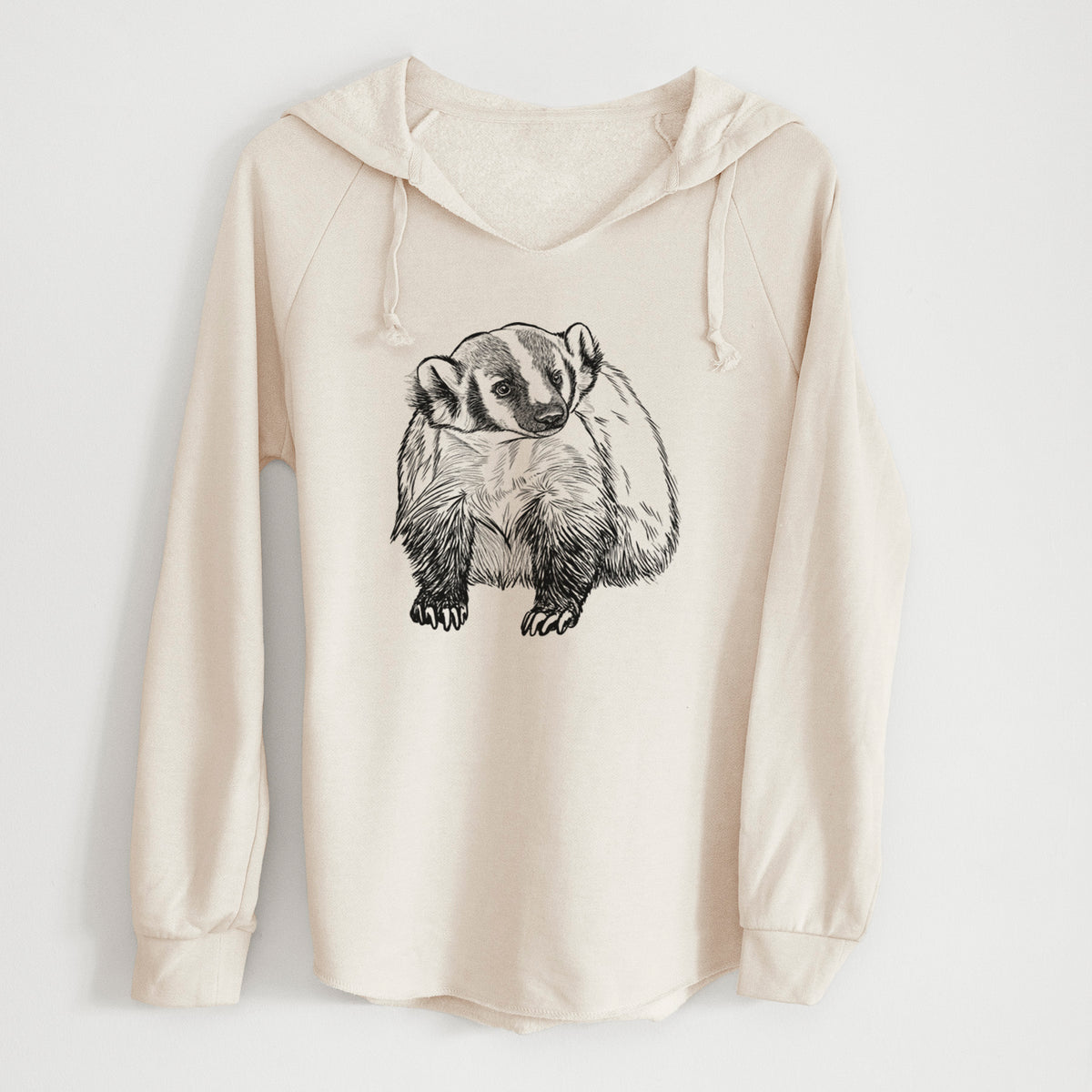 Bone cream women's Cali Wave hooded sweatshirt laid flat, printed with a detailed black ink illustration of an American badger facing forward.
