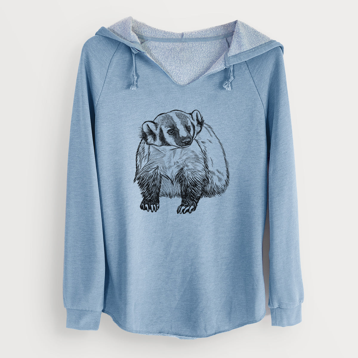 Misty blue women's Cali Wave hooded sweatshirt laid flat, printed with a detailed black ink illustration of an American badger facing forward.