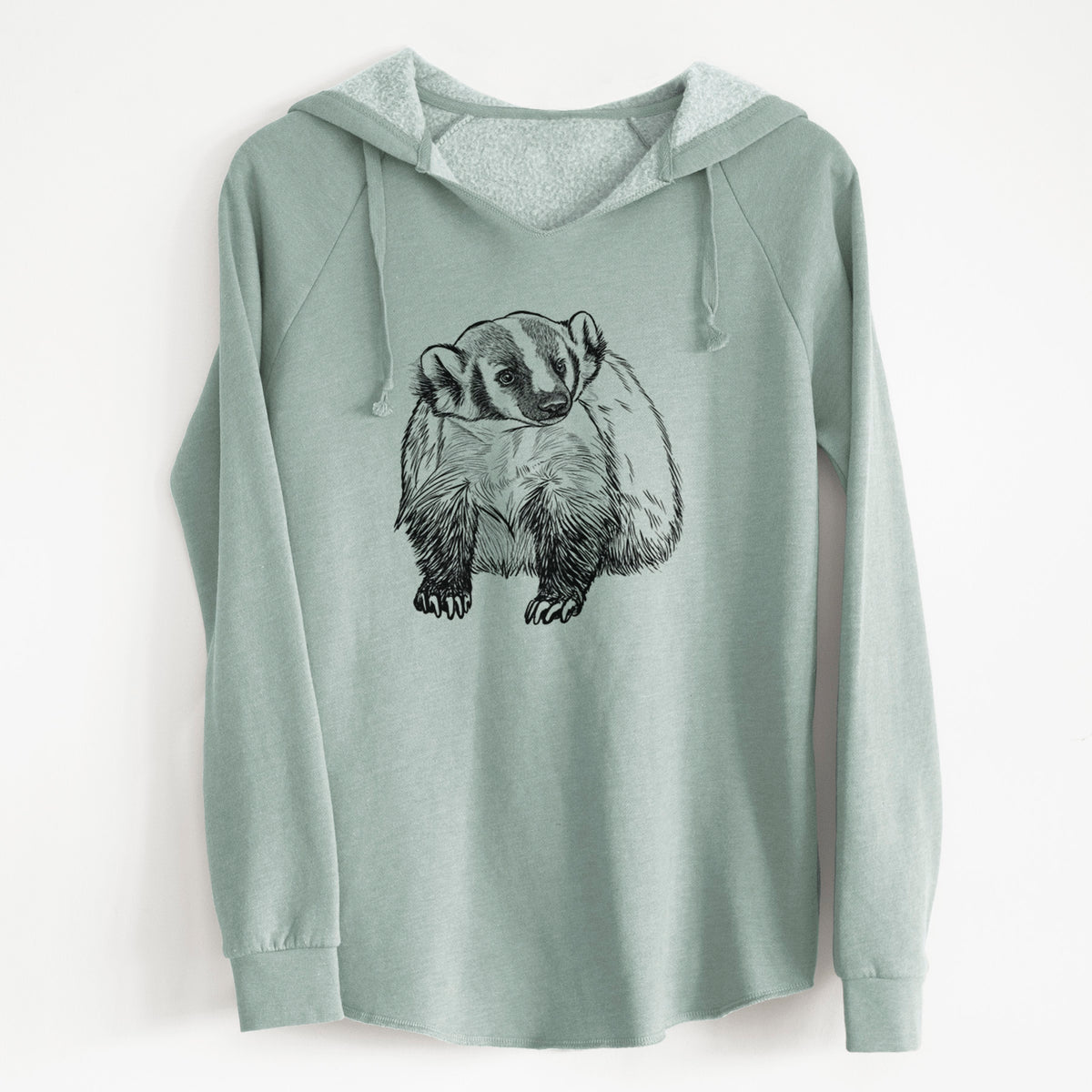 Sage green women's Cali Wave hooded sweatshirt laid flat, printed with a detailed black ink illustration of an American badger facing forward.