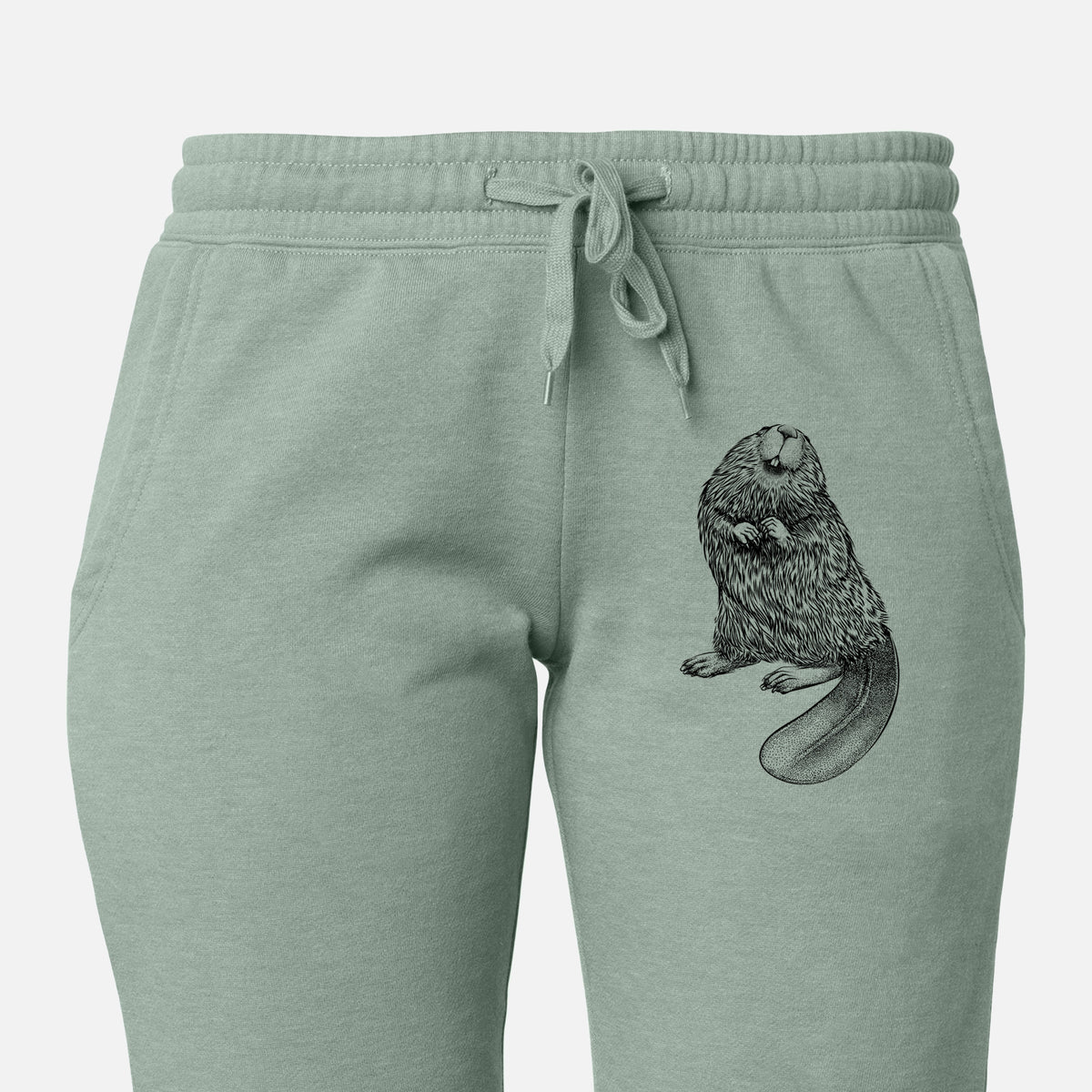 Front of sage green Cali Wave sweatpants, printed with a detailed black ink illustration of an American beaver sitting upright with its flat tail on the leg.
