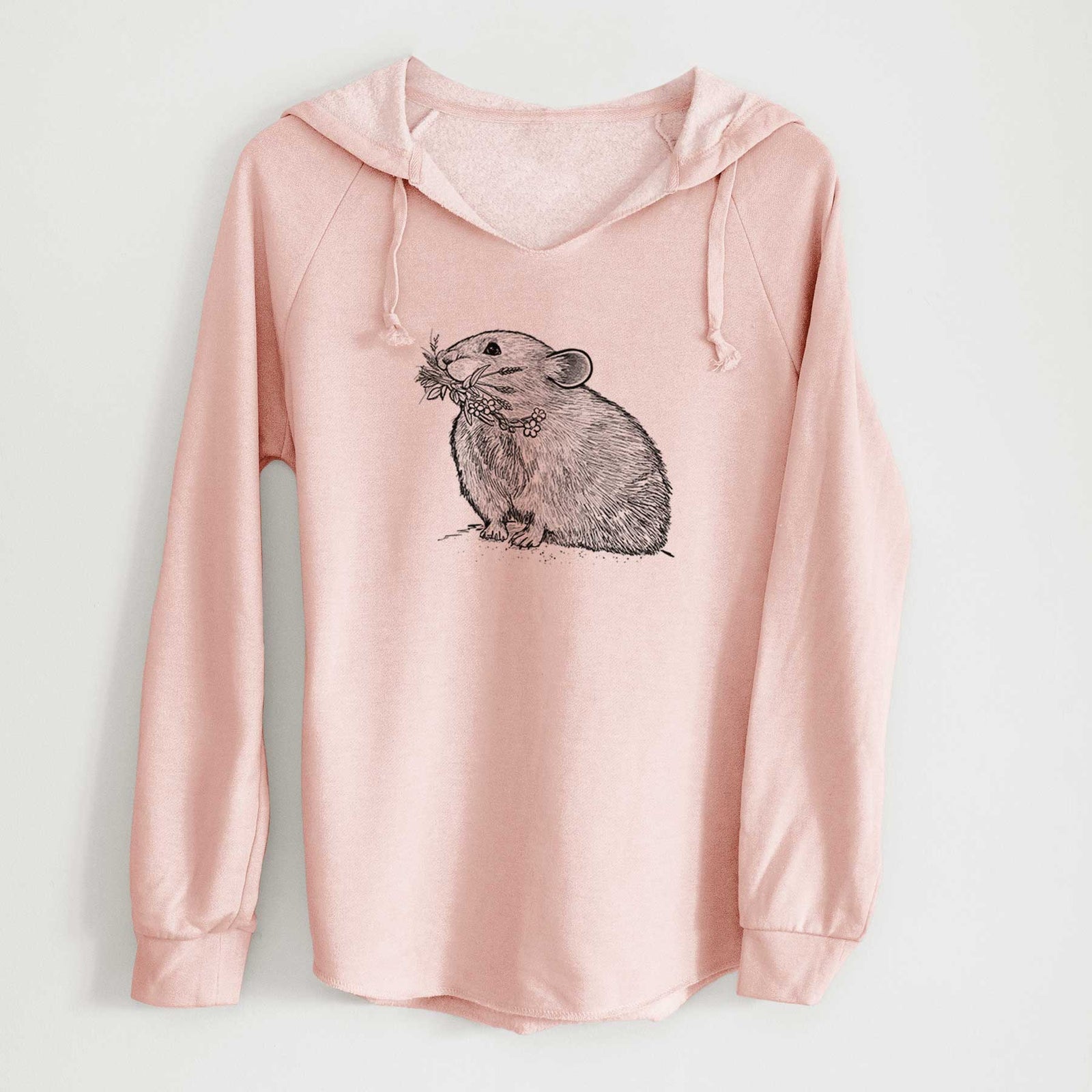 Blush pink women's Cali Wave hooded sweatshirt laid flat, printed with a detailed black ink illustration of an American pika holding flowers and grass in its mouth.