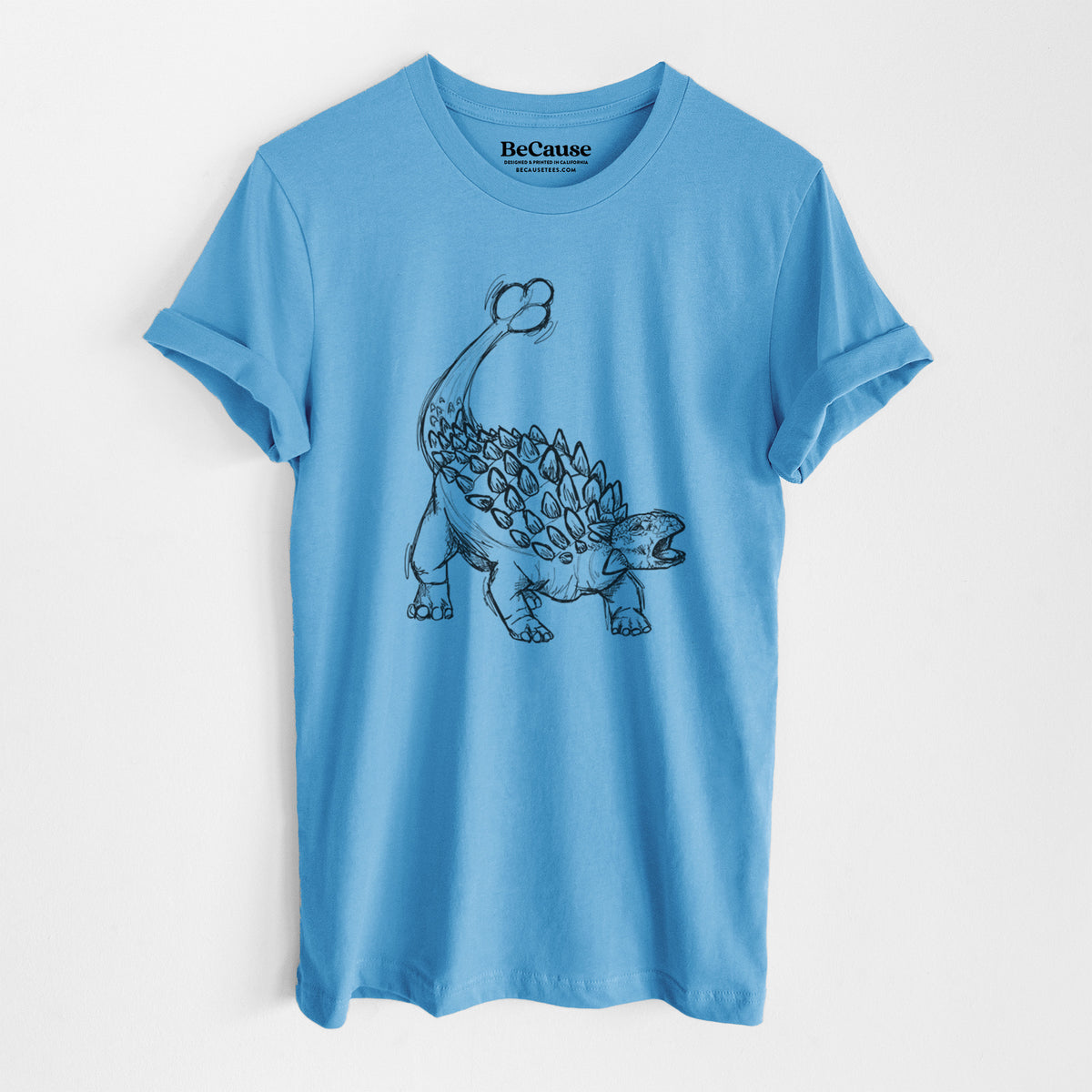 Ocean blue lightweight cotton t-shirt laid flat, printed with a black ink illustration of an Ankylosaurus with its club tail raised.