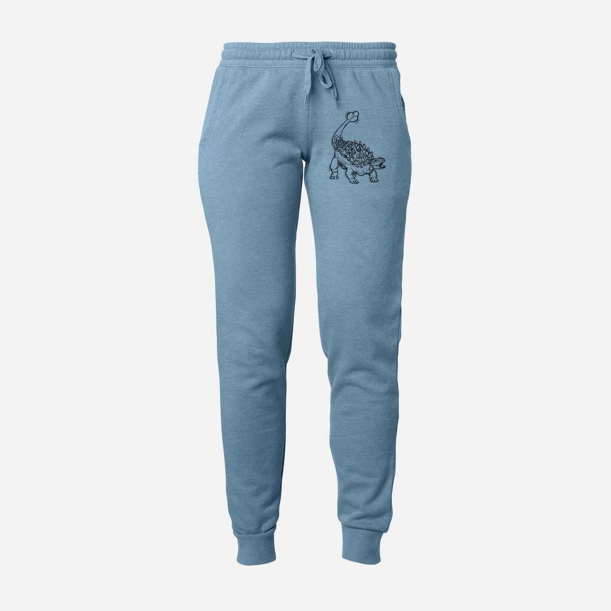 Front of misty blue Cali Wave sweatpants, printed with a black ink illustration of an Ankylosaurus with its club tail raised on the leg.