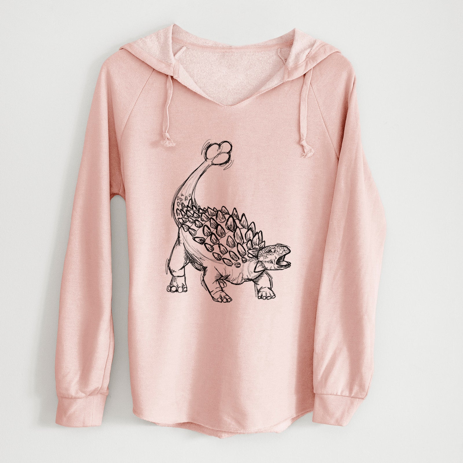 Sage green women's Cali Wave hooded sweatshirt laid flat, printed with a black ink illustration of an Ankylosaurus with its club tail raised.