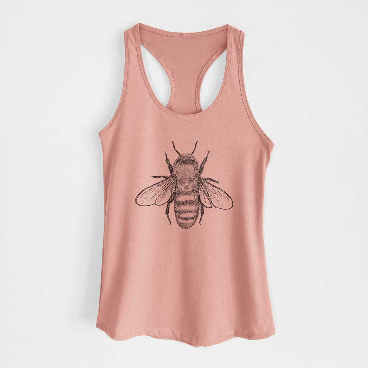 Desert pink women's racerback tank top laid flat, printed with a detailed black ink illustration of a honey bee with its wings spread, seen from above.