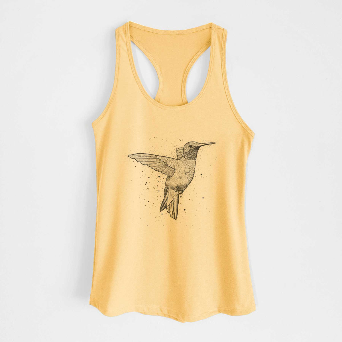 Banana cream women's racerback tank top laid flat, printed with a black ink sketch of a ruby-throated hummingbird hovering with its wings raised.