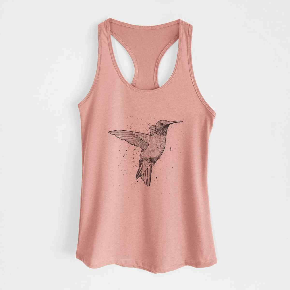 Desert pink women's racerback tank top laid flat, printed with a black ink sketch of a ruby-throated hummingbird hovering with its wings raised.