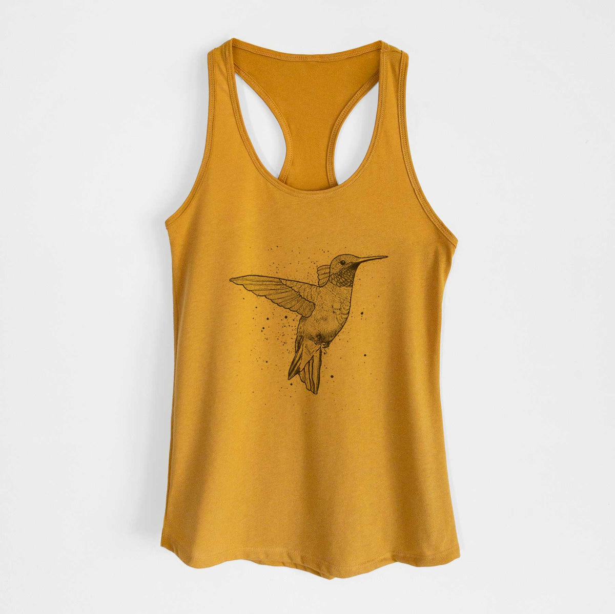 Gold women's racerback tank top laid flat, printed with a black ink sketch of a ruby-throated hummingbird hovering with its wings raised.