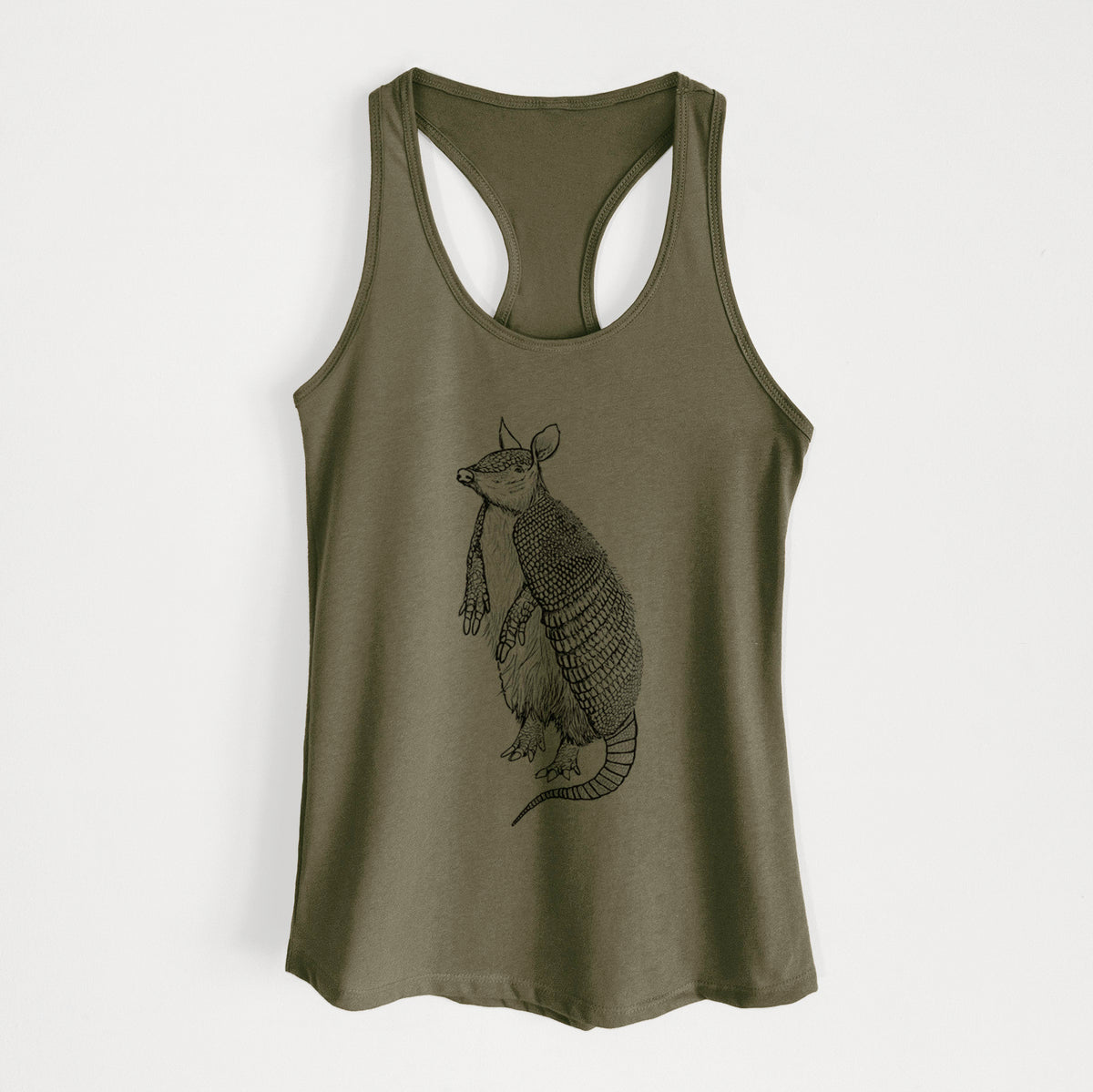 Military green women's racerback tank top laid flat, printed with a black ink illustration of a nine-banded armadillo standing upright.
