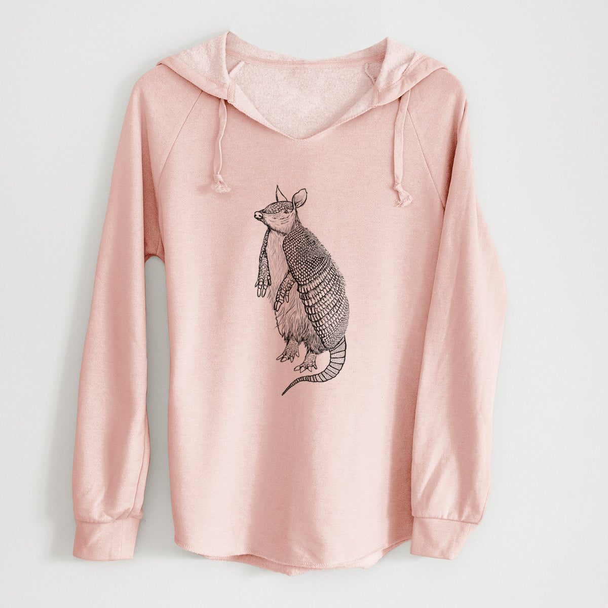 Blush pink women's Cali Wave hooded sweatshirt laid flat, printed with a black ink illustration of a nine-banded armadillo standing upright.