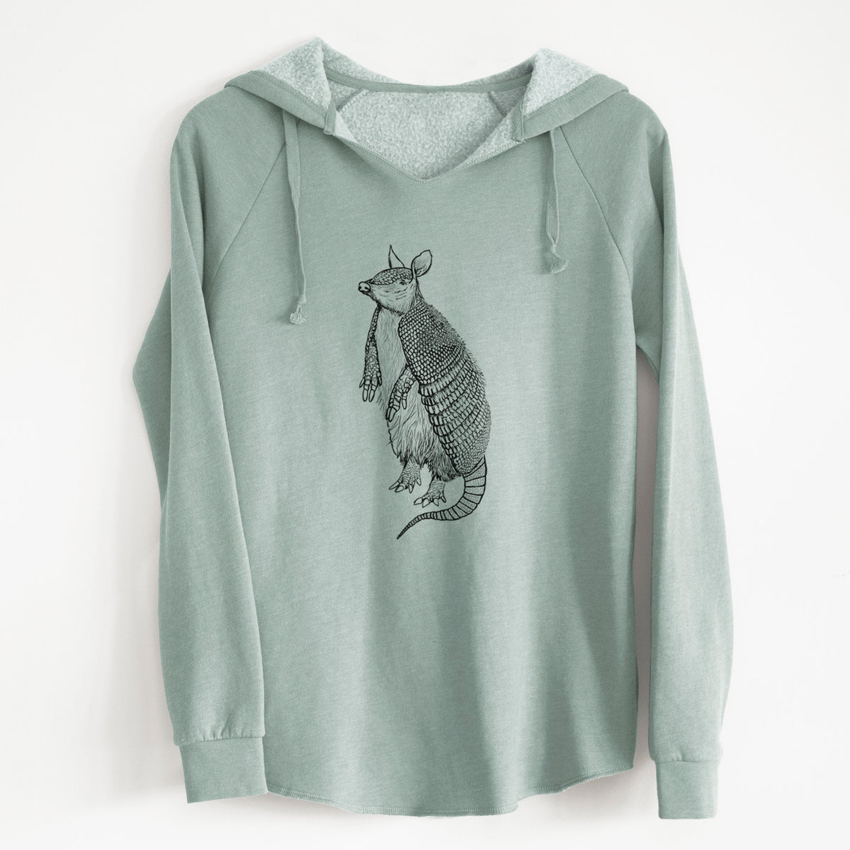 Sage green women's Cali Wave hooded sweatshirt laid flat, printed with a black ink illustration of a nine-banded armadillo standing upright.