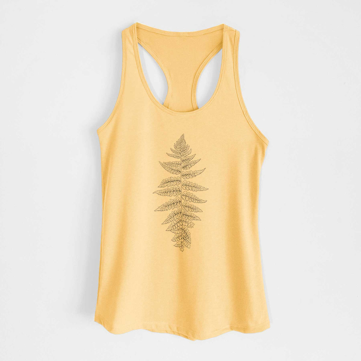 Banana cream women's racerback tank top laid flat, printed with a black ink illustration of a lady fern frond.