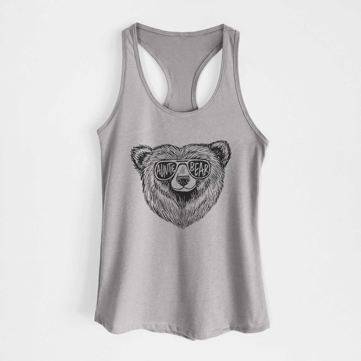 Heather grey women's racerback tank top laid flat, printed with a black ink bear's face wearing sunglasses that read Auntie Bear.